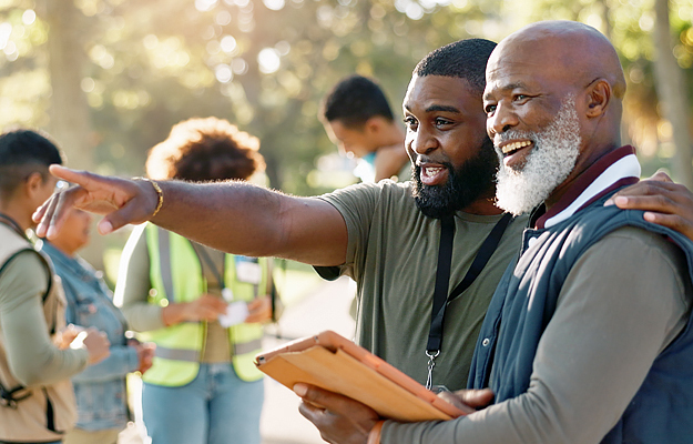 A senior man doing volunteer work with his community.