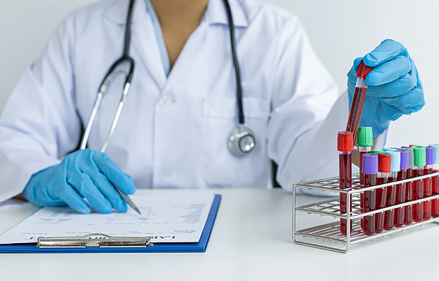 A medical laboratory scientist analyzing blood samples.