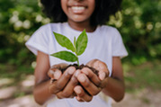 girl holding a plant