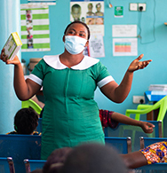 A midwife counsels pregnant women in a classroom in Ghana