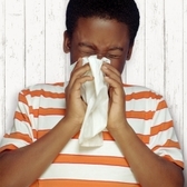 colds child sneezing