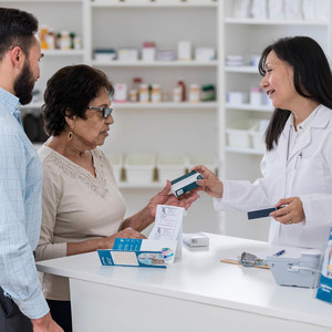 Pharmacist with clients
