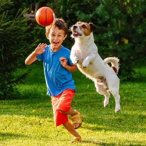 ADHD child playing with a dog 