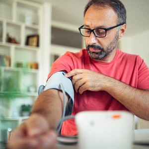 man taking blood pressure