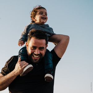 Father with son on his shoulders