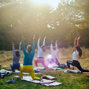 People outdoors practicing yoga