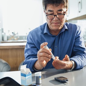 Person testing their blood glucose