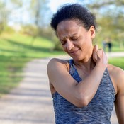 Pain Ratings in Women Research Spotlight Woman Grabbing Shoulder and Neck