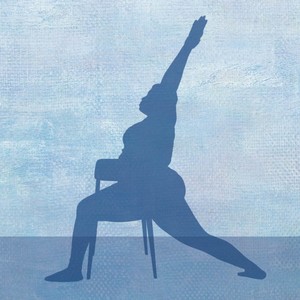 silhouette of woman practicing yoga with a chair