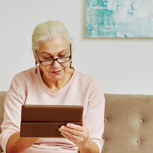 woman reading ipad selecting a complimentary health provider