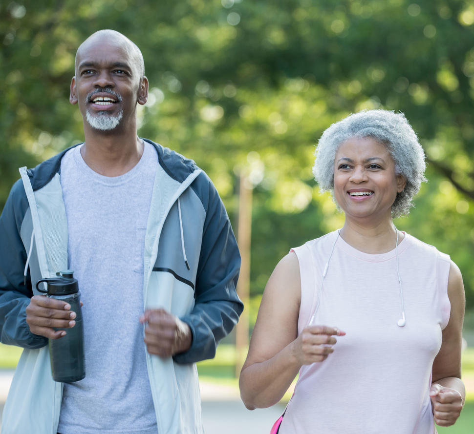 older-african-american-couple-walking-in-park