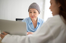 Asian woman with a female doctor