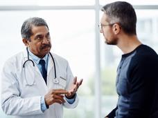 doctor talking with male patient