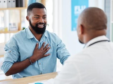 man consulting with doctor