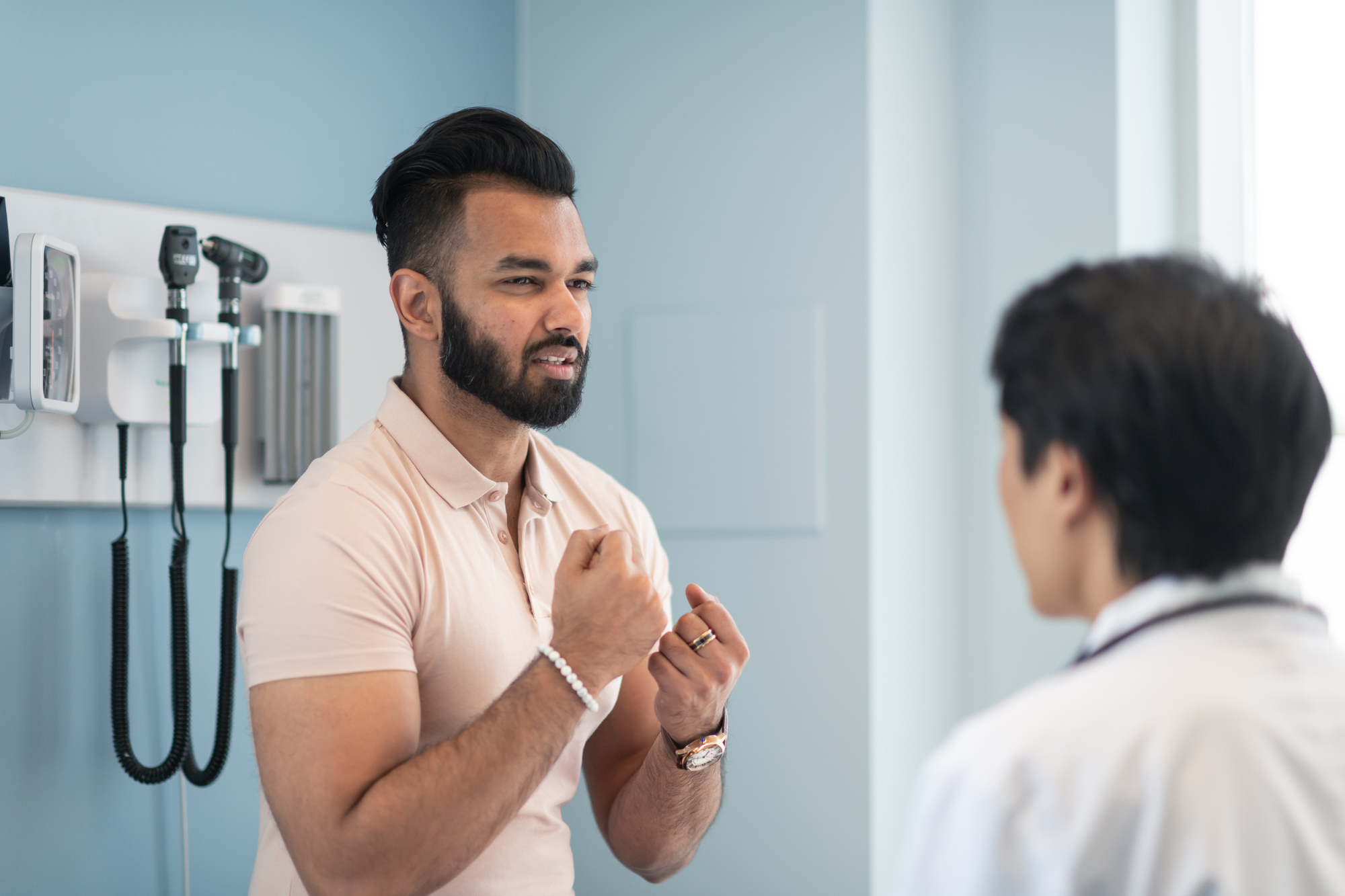 Young man with doctor.