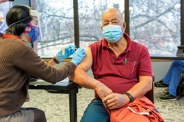 man getting vaccine