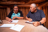 man and woman sitting at table