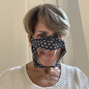 NIDCD Director Debara Tucci wearing a clear face mask.