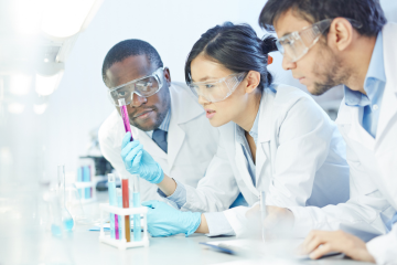 scientists examining a test tube