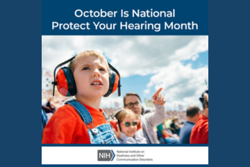 Young child with protective earmuffs at sporting event. Text reads: National Protect Your Hearing Month.