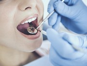 dentist examining mouth