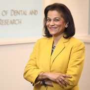 Dr. Rena D'Souza dressed in yellow