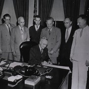 Harry Truman signing bill establishing National Institute of Dental Research