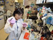 person weating goggles in a lab, working with equipment