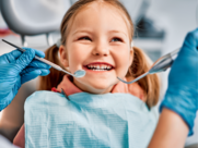 child smiling in dentist chair