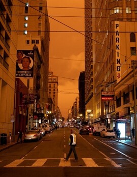 orange sky in city from wildfire smoke