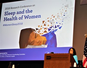 Dr. Rina Das presenting at the podium at the 2018 Women's Sleep Conference