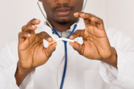 African American physician bending a cigarette