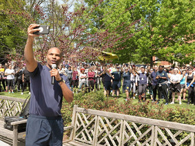 U.S. Surgeon General Jerome takes a selfie with the crowd at the third annual NIMHD 5K