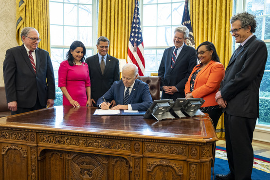 Dr. Pérez-Stable, NIH Director Dr. Tabak and President Joe Biden at the White House bill signing 