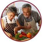 Elderly couple preparing vegetables