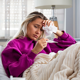 Woman sick with fever