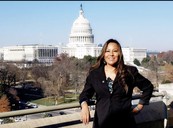 A photo of Glorinda Segay in front of the U.S. Capitol Hill.