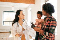 A mother and toddler with a health care provider.