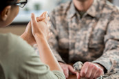A mental health provider talks with a veteran