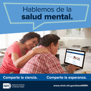 Hablemas de la salud mental. A woman and man sitting in front of a computer looking for health information. 