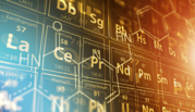 Illustration of periodic table overlaid with molecular diagram