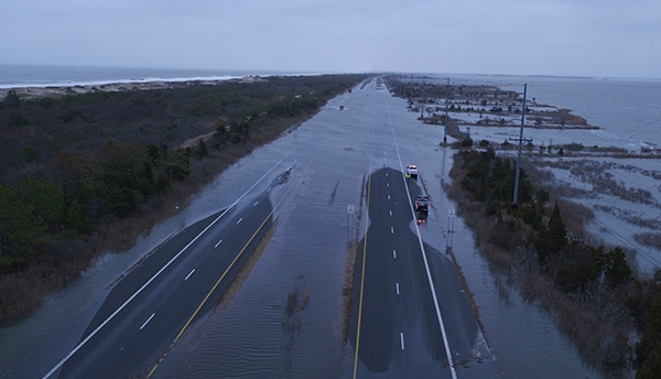 An overhead view of a flooded highway in Delaware with water on both sides.