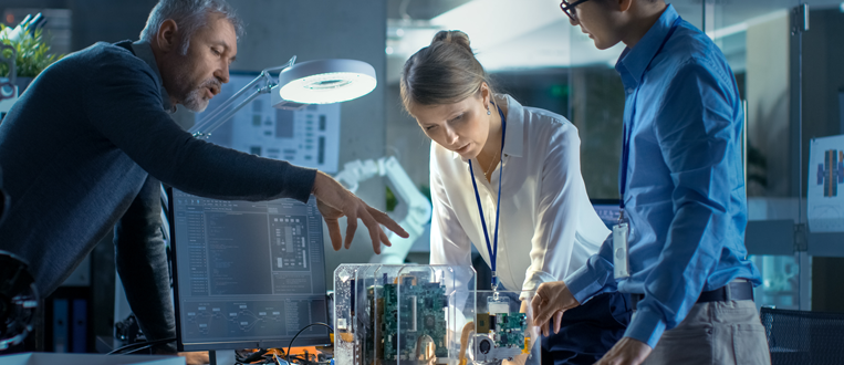 engineers looking at a prototype in a reasearch center