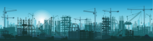 Illustration shows construction cranes over a city skyline. 