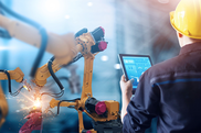 young man using artificial intellilgence in a manufacturing factory