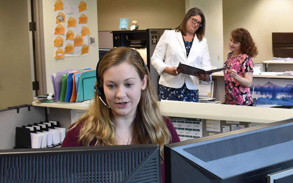 Illinois Municipal Retirement Fund employees working at the call center.