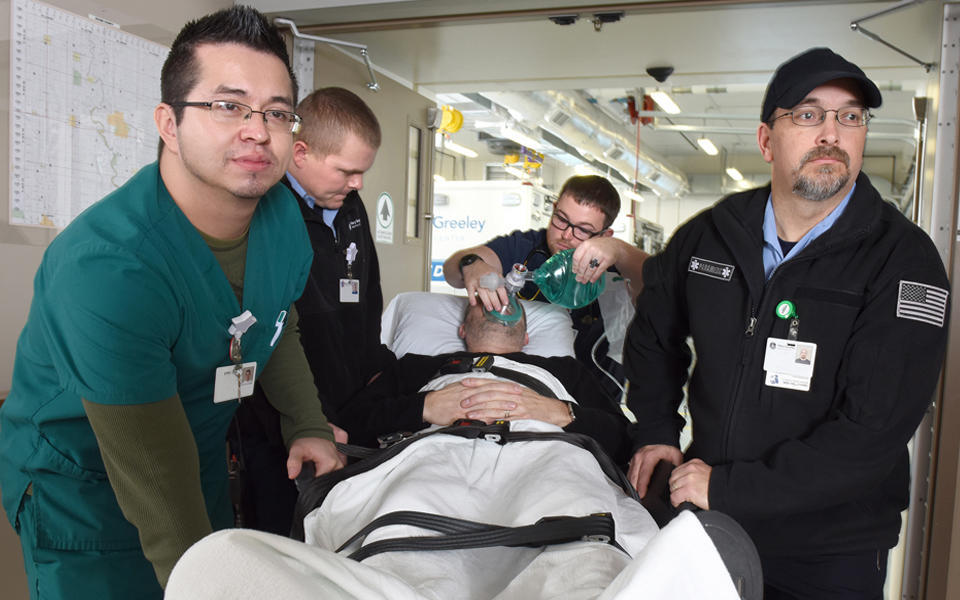 Mary Greeley Medical Center employees bringing patient into emergency care.