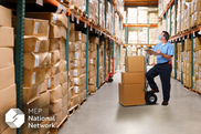 man looking at warehouse inventory