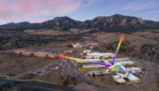 Overhead photo of Boulder lab buildings includes arrows showing laser beams used in experiments.