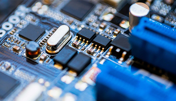 Close-up view of transistors and other electronic components mounted on a board.